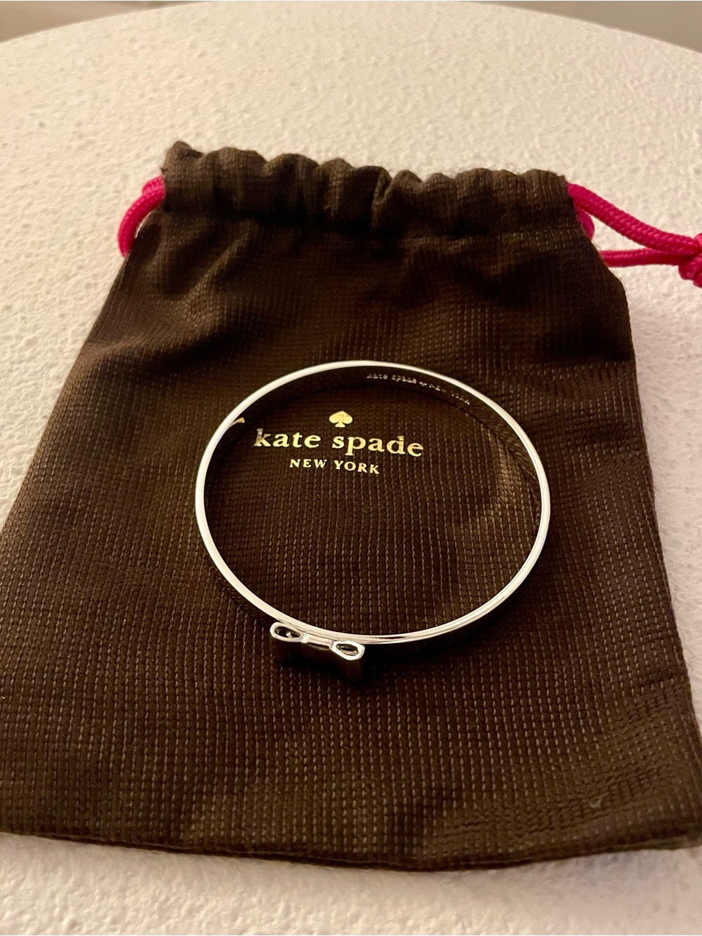 kate spade silver-tone bow bangle bracelet